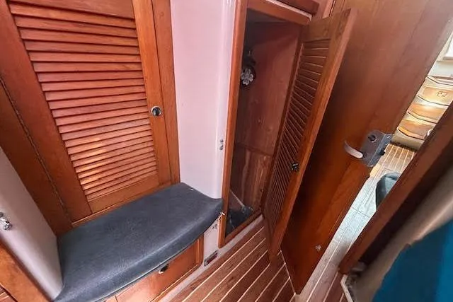 Slide: The Image of Interior of 2000 Catalina 42 Mk II sailboat with wooden cabinets and seating. - 18