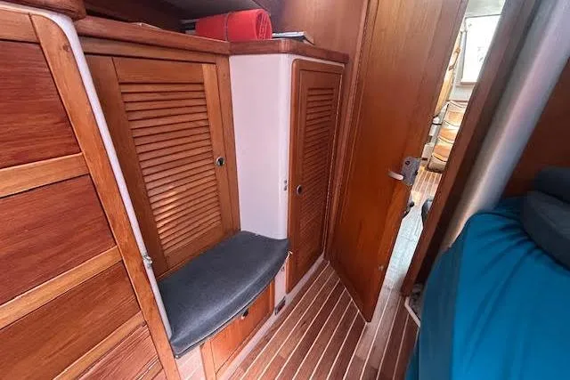Slide: The Image of Interior of 2000 Catalina 42 Mk II sailboat with wooden cabinets and seating. - 19