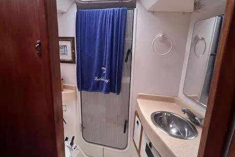 Slide: The Image of Bathroom interior of 2000 Catalina 42 Mk II sailboat with sink and shower. - 23