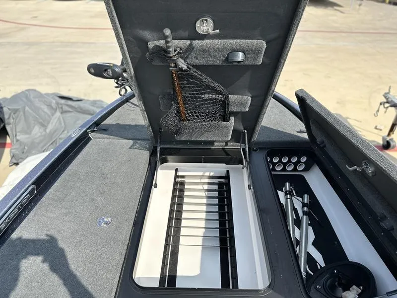 Slide: The Image of 2019 Skeeter FX21 LE boat storage compartments with fishing rod holders and accessories. - 16