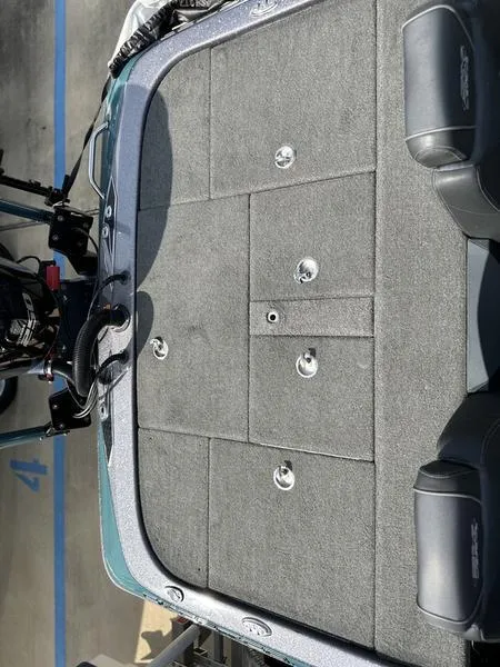 Slide: The Image of 2019 Skeeter FX21 LE boat deck with storage compartments and seating. - 6