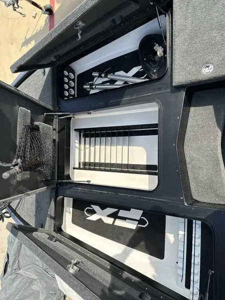 Slide: The Image of 2019 Skeeter FX21 LE boat storage compartments and equipment. - 7