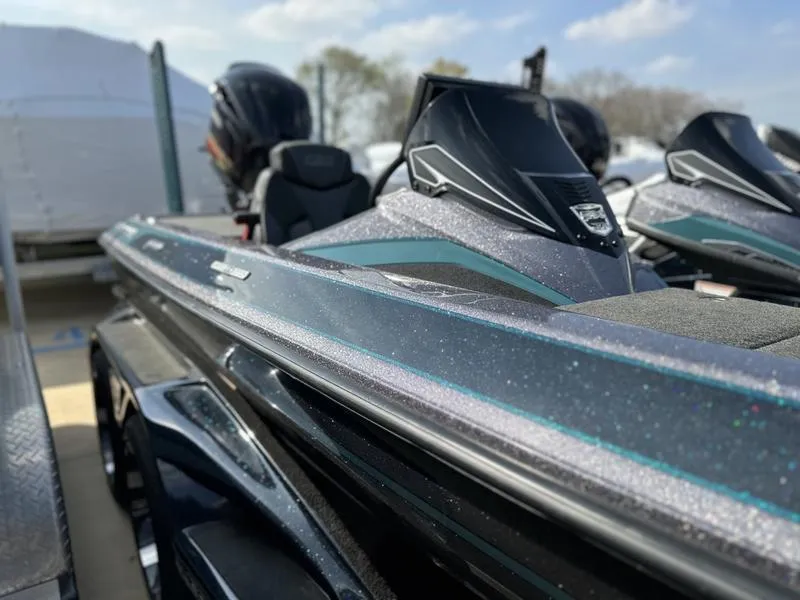 Slide: The Image of 2019 Skeeter FX21 LE bass boat, close-up side view, metallic finish. - 8