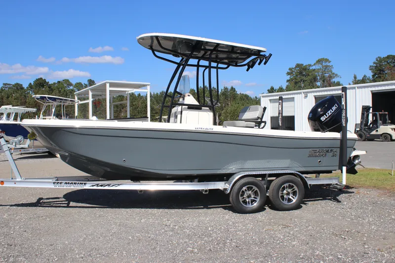 The Image of 2025 Carolina Skiff 21 Ultra Elite boat on trailer, parked outdoors. - 0