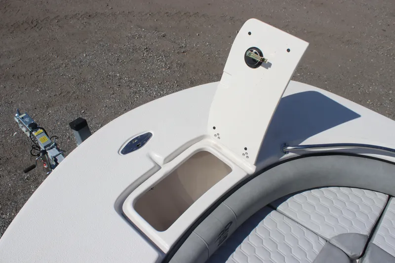 Slide: The Image of 2025 Carolina Skiff 21 Ultra Elite boat storage compartment with open hatch, showing interior details. - 14