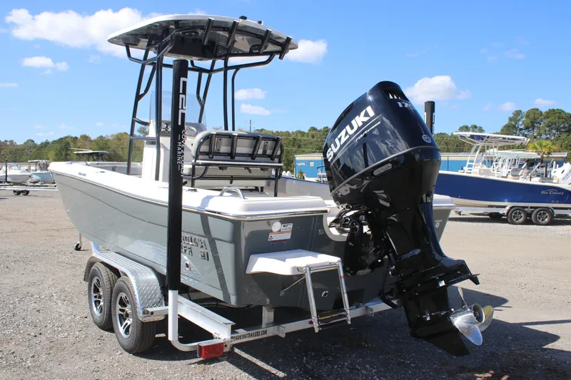 Slide: The Image of 2025 Carolina Skiff 21 Ultra Elite boat with Suzuki outboard motor on trailer. - 4