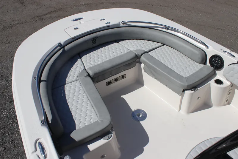 Slide: The Image of 2025 Carolina Skiff 21 Ultra Elite boat with gray cushioned seating. - 6