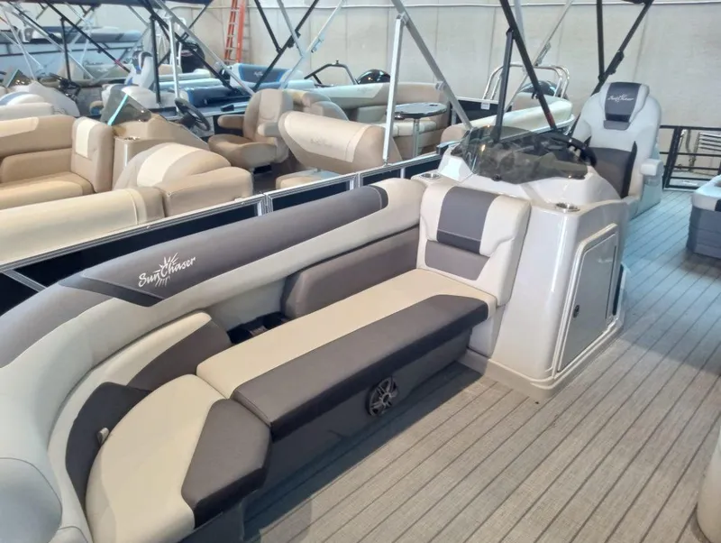 Slide: The Image of 2023 SunChaser Geneva Sport 25 SB pontoon boat interior with gray and beige seating. - 4