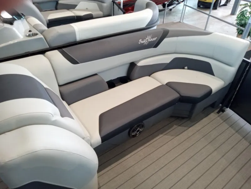 Slide: The Image of 2023 SunChaser Geneva Sport 25 SB boat interior with gray and white seating. - 5