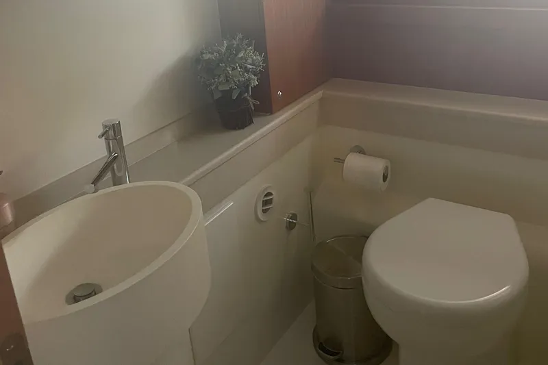Slide: The Image of Bathroom interior of 2012 Ferretti Yachts 530, featuring modern sink and toilet. - 12