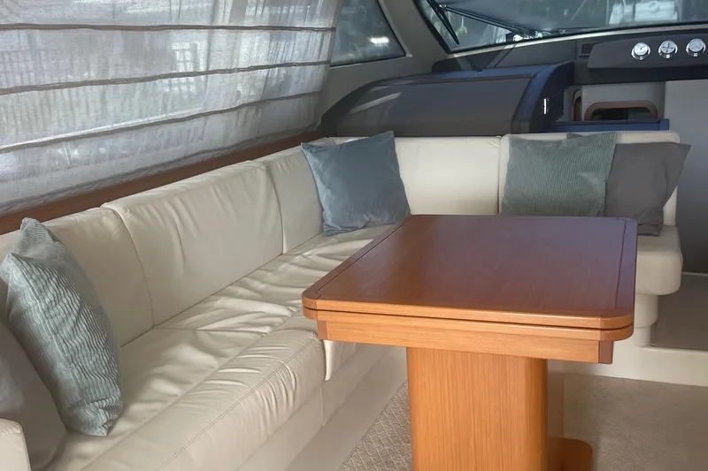 Slide: The Image of Luxurious interior of 2012 Ferretti Yachts 530 with elegant seating and wooden table. - 3