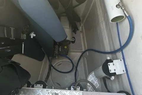 Slide: The Image of Engine room of a 2016 Leopard 48 yacht, featuring hoses and mechanical components. - 12