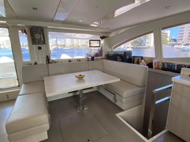 Slide: The Image of Luxurious interior of a 2016 Leopard 48 yacht with spacious seating and waterfront view. - 14