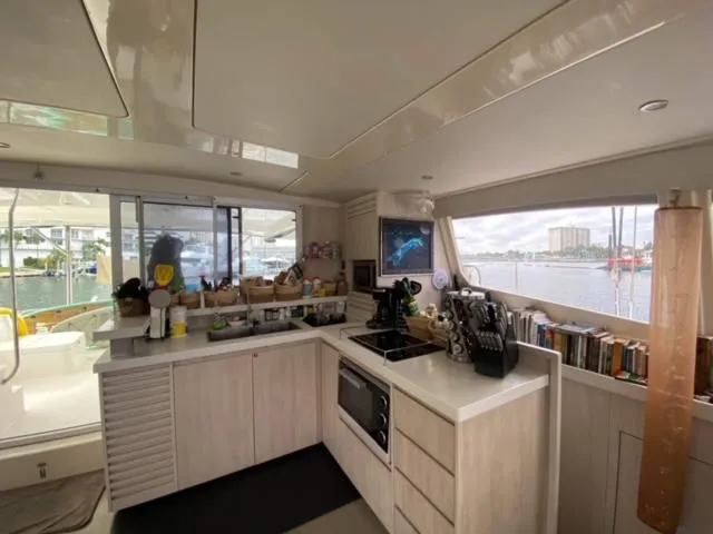Slide: The Image of Modern kitchen interior on a 2016 Leopard 48 yacht with scenic window view. - 17