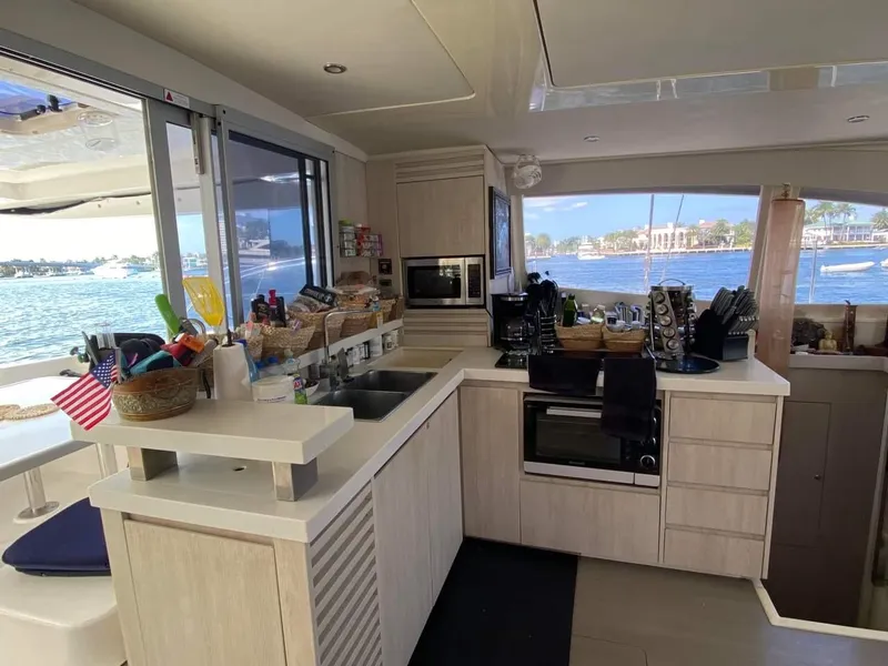 Slide: The Image of Modern kitchen interior on a 2016 Leopard 48 yacht with ocean view. - 18