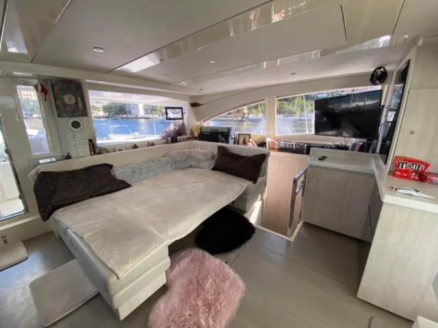 Slide: The Image of Luxurious interior of a 2016 Leopard 48 yacht with plush seating and modern amenities. - 19