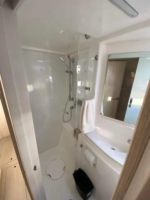 Slide: The Image of Modern bathroom in a 2016 Leopard 48 yacht, featuring a shower and sink. - 24