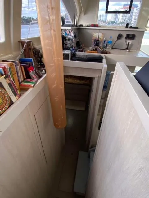 Slide: The Image of Interior of 2016 Leopard 48 yacht with books and modern amenities. - 25