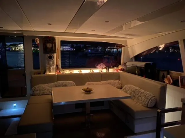Slide: The Image of Luxurious interior of a 2016 Leopard 48 yacht with cozy seating and ambient lighting. - 28