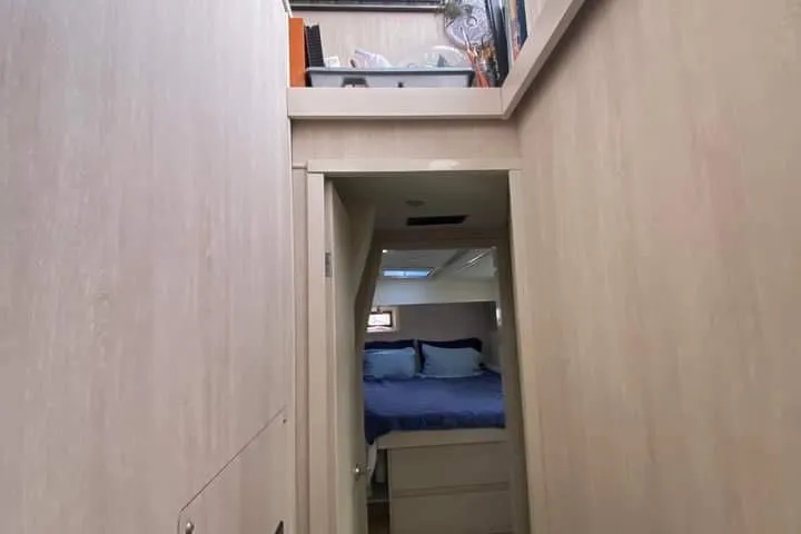 Slide: The Image of Interior hallway of 2016 Leopard 48 yacht leading to a cozy bedroom. - 34