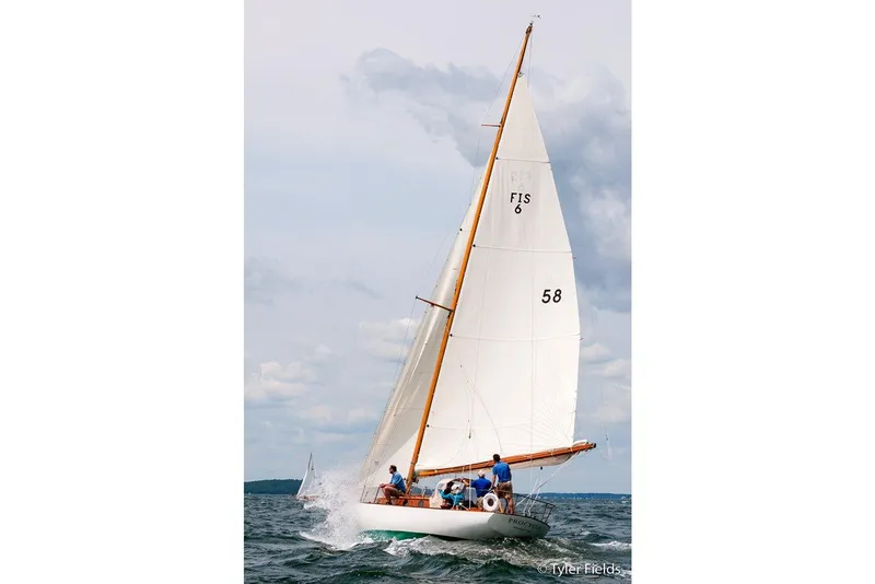 Slide: The Image of 1929 Herreshoff Fishers Island 31 sailboat navigating open waters. - 10