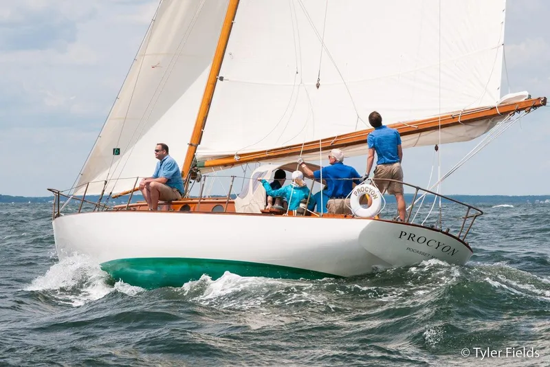 Slide: The Image of Sailing Herreshoff Fishers Island 31, 1929 model, on open water with crew onboard. - 7