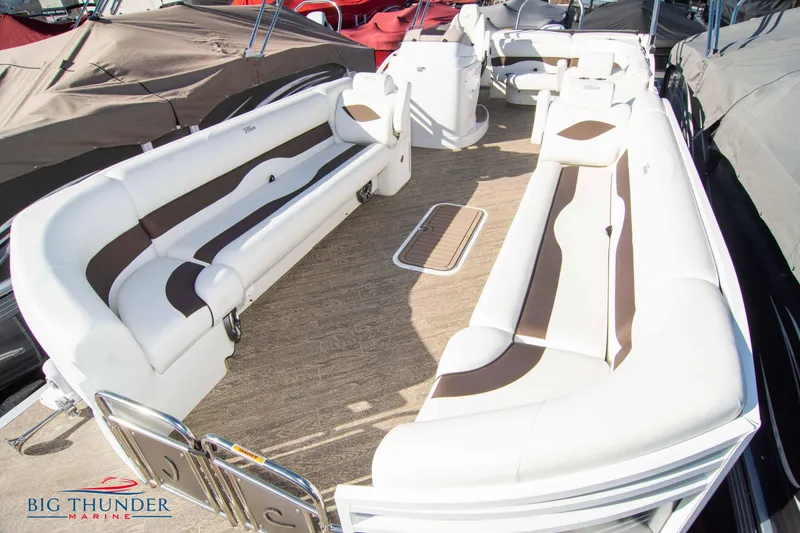 Slide: The Image of Luxury interior of 2022 JC NEPTOON 27 TT SPORT pontoon boat with white and brown seating. - 10