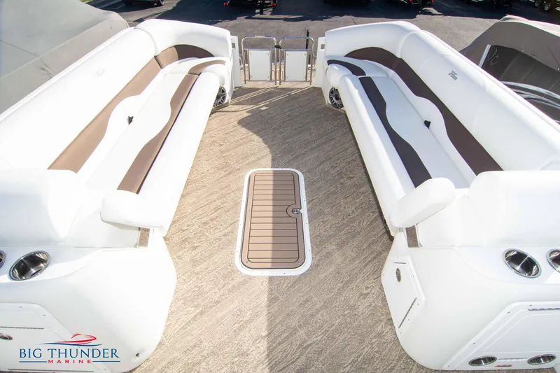 Slide: The Image of Interior of 2022 JC NEPTOON 27 TT SPORT boat with white and brown seating. - 13
