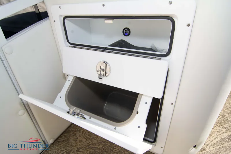 Slide: The Image of Open storage compartment on a 2022 JC NEPTOON 27 TT SPORT boat. - 18
