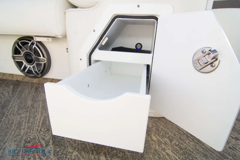 Slide: The Image of Open storage compartment on a 2022 JC NEPTOON 27 TT SPORT boat. - 21