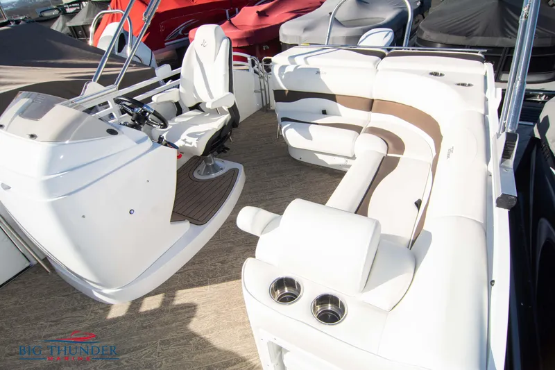 Slide: The Image of Interior of 2022 JC NEPTOON 27 TT SPORT boat with white seating and helm. - 22