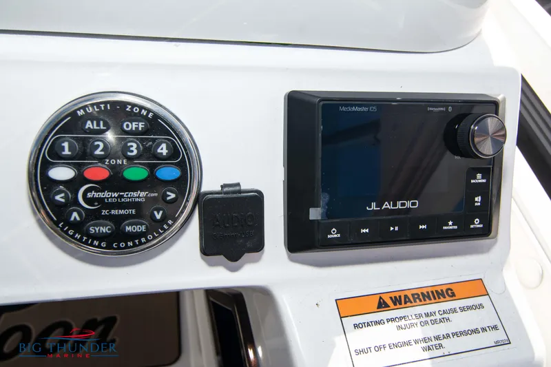 Slide: The Image of Control panel of a 2022 JC NEPTOON 27 TT SPORT boat with JL Audio system. - 31
