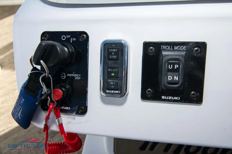 Slide: The Image of Control panel of JC NEPTOON 27 TT SPORT 2022 boat with Suzuki start/stop and troll mode. - 32