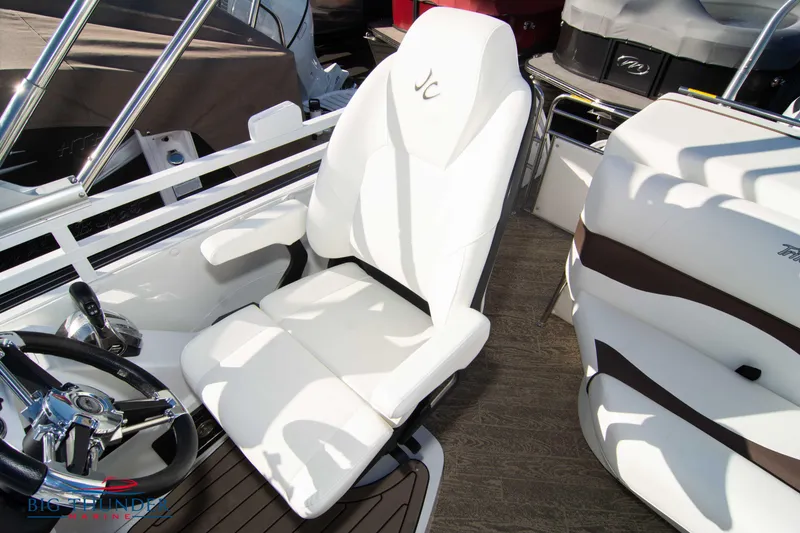 Slide: The Image of 2022 JC NEPTOON 27 TT SPORT boat interior with white captain's chair and steering wheel. - 36