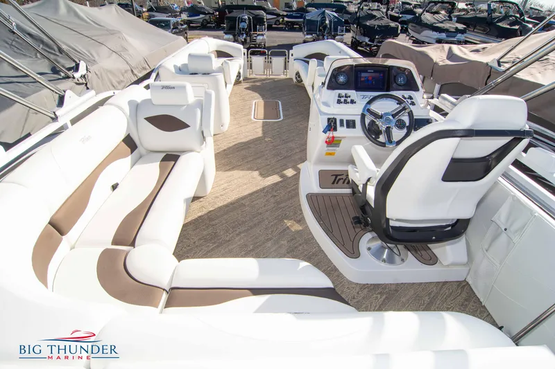Slide: The Image of 2022 JC NEPTOON 27 TT SPORT boat interior with white and brown seating, steering console. - 39