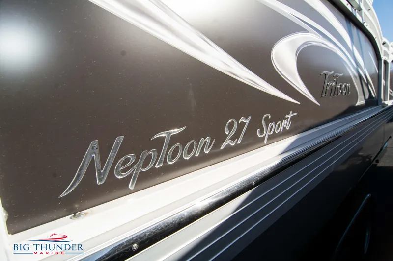 Slide: The Image of 2022 JC NepToon 27 TT Sport boat side view with Big Thunder Marine logo. - 8
