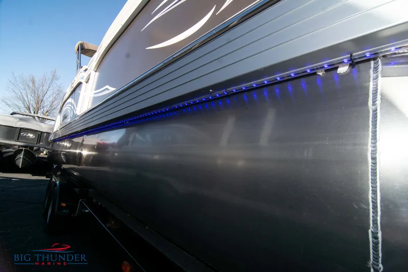 Slide: The Image of 2022 JC NEPTOON 27 TT SPORT boat with blue LED lights on the side. - 9