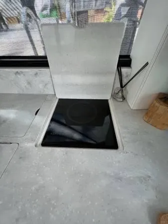 Slide: The Image of Modern kitchen stove in 2023 Regal 36 XO yacht. - 15