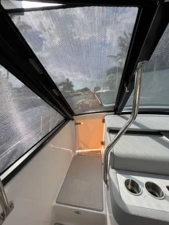 Slide: The Image of Interior view of 2023 Regal 36 XO boat with seating and cup holders. - 17
