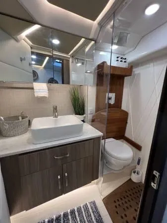 Slide: The Image of 2023 Regal 36 XO yacht bathroom with modern fixtures and elegant design. - 19