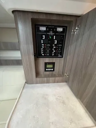 Slide: The Image of Electrical control panel inside 2023 Regal 36 XO boat. - 23
