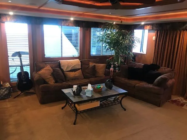 Slide: The Image of Luxurious 2007 Thoroughbred houseboat interior with cozy seating, guitar, and large windows. - 10