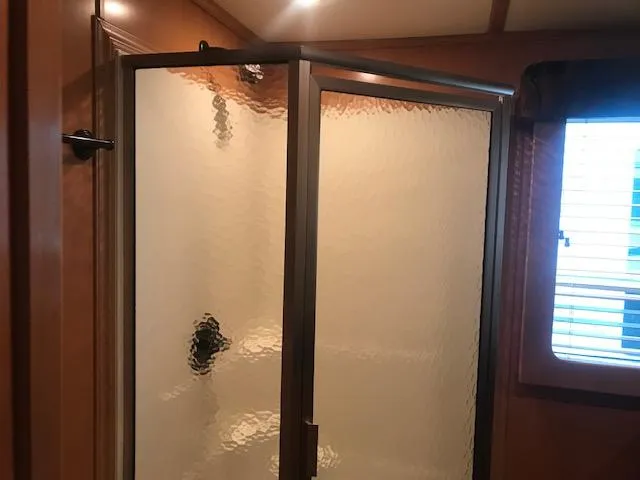 Slide: The Image of Shower enclosure in 2007 Thoroughbred houseboat bathroom. - 16