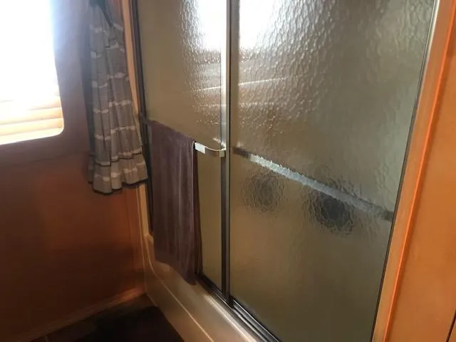 Slide: The Image of Houseboat bathroom with frosted glass shower door and window, Thoroughbred model, 2007. - 29