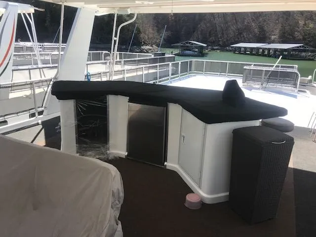 Slide: The Image of 2007 Thoroughbred houseboat with outdoor bar and seating area on deck. - 35