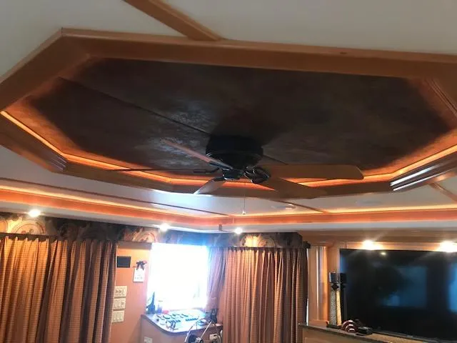 Slide: The Image of Luxurious interior of a 2007 Thoroughbred houseboat with ceiling fan and ambient lighting. - 9