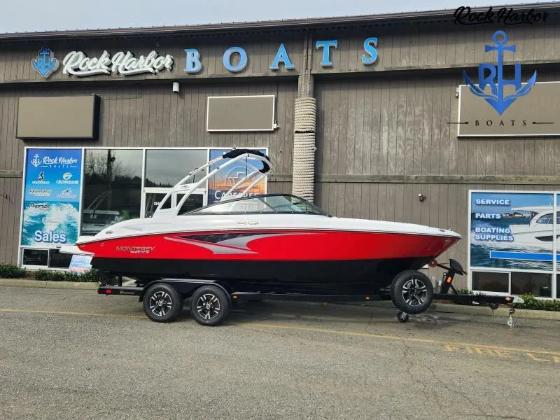 The Image of 2023 Monterey M-22 boat in red and black on trailer outside Rock Harbor Boats. - 0