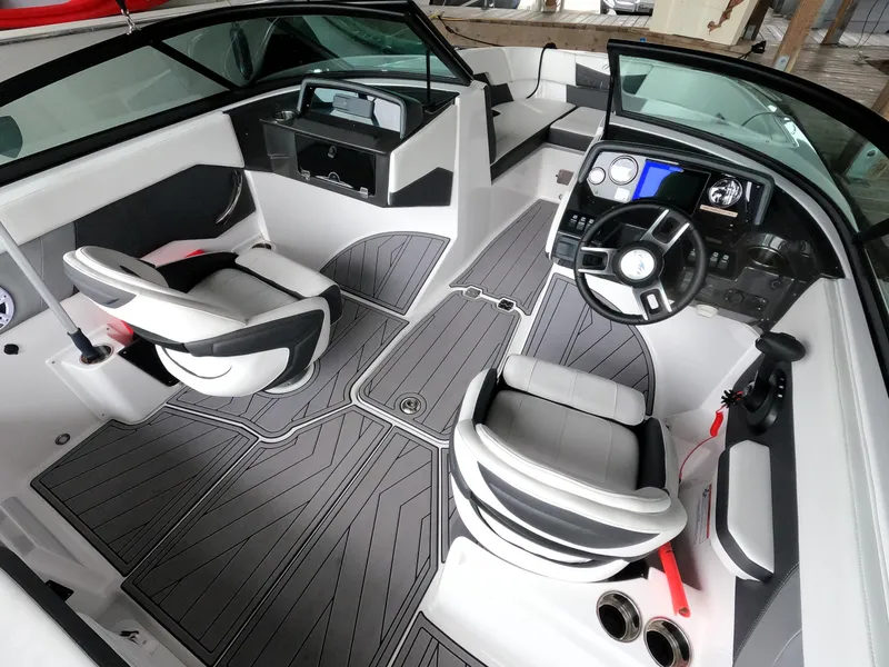 Slide: The Image of 2023 Monterey M-22 boat interior with modern dashboard and seating. - 15