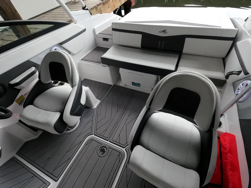 Slide: The Image of 2023 Monterey M-22 boat interior with grey and white seating. - 17