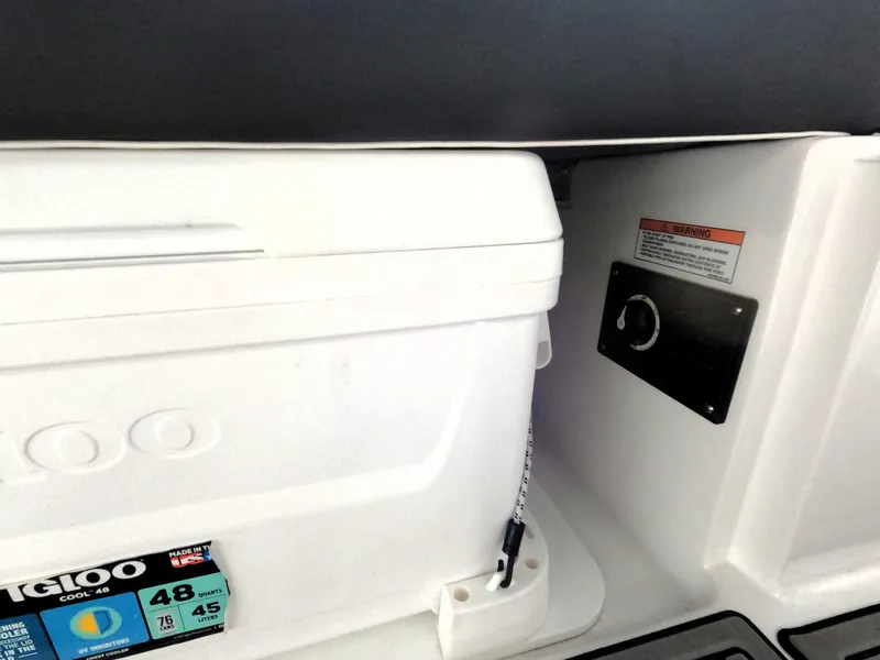Slide: The Image of Monterey M-22 2023 boat interior with Igloo cooler and control panel. - 18